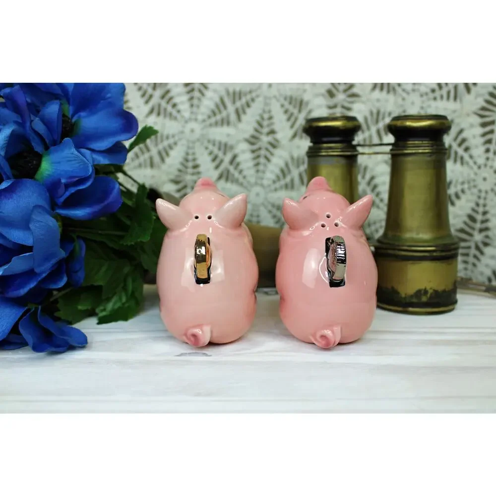 1999 Clay Art Pig Coins Salt and Pepper shakers.